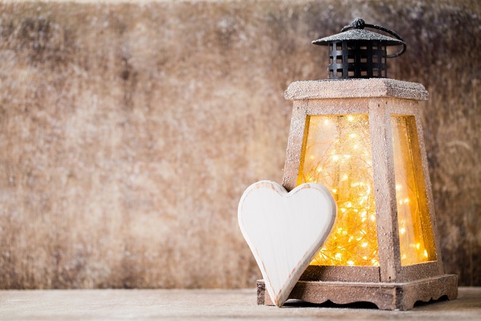 Wooden lantern with fairy lights and heart decoration
