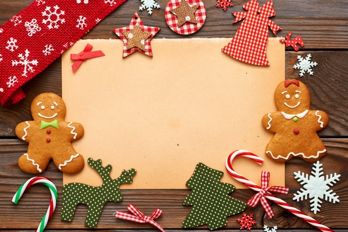 Christmas cookies and decorations on a wooden background