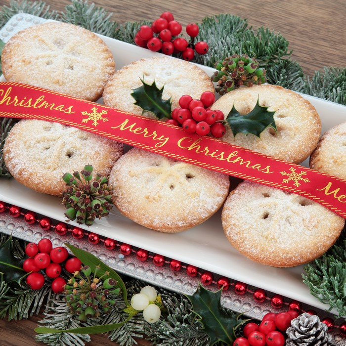 Christmas pastries with ribbon and berries