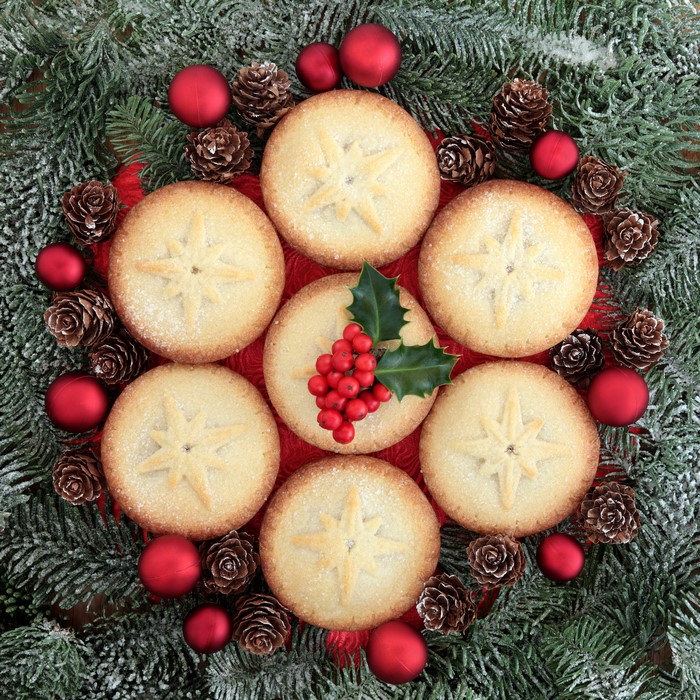 Christmas mince pies with holly and pine cones