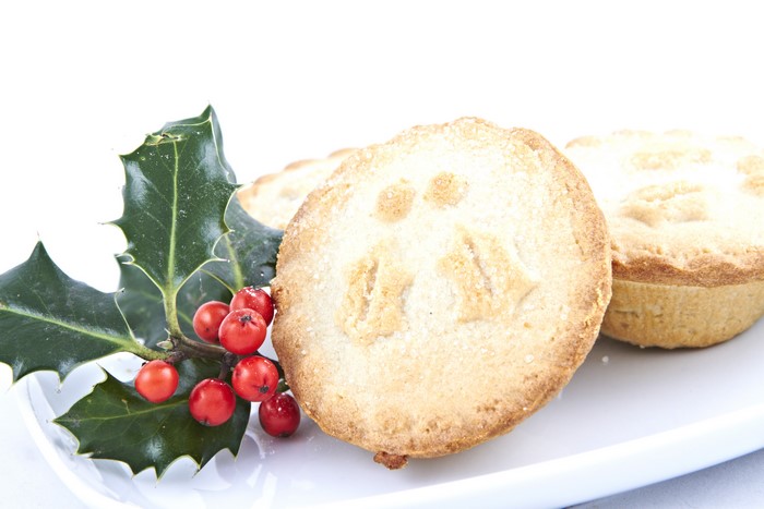 Christmas mince pies with holly and berries