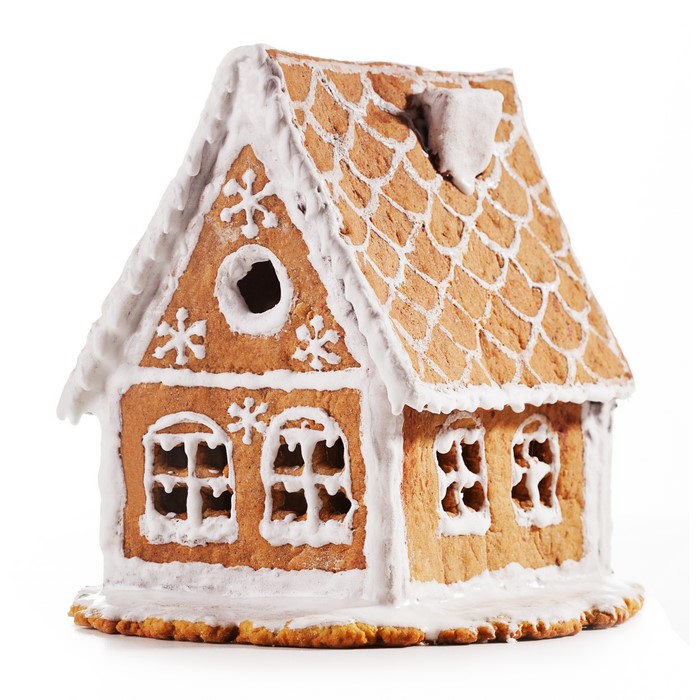 Gingerbread house with white icing and snowflakes