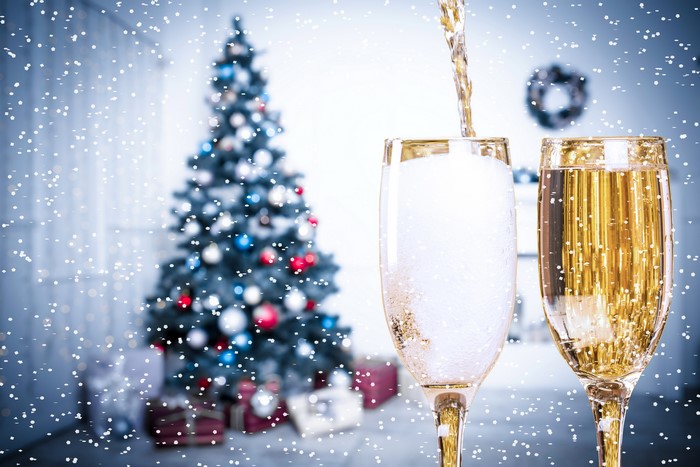 Champagne glasses and Christmas tree with snow