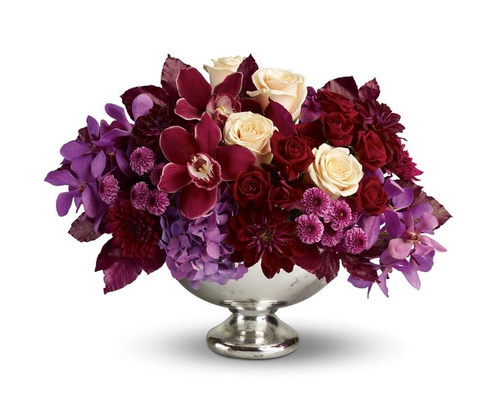 Orchid and Rose floral arrangement in a silver vase