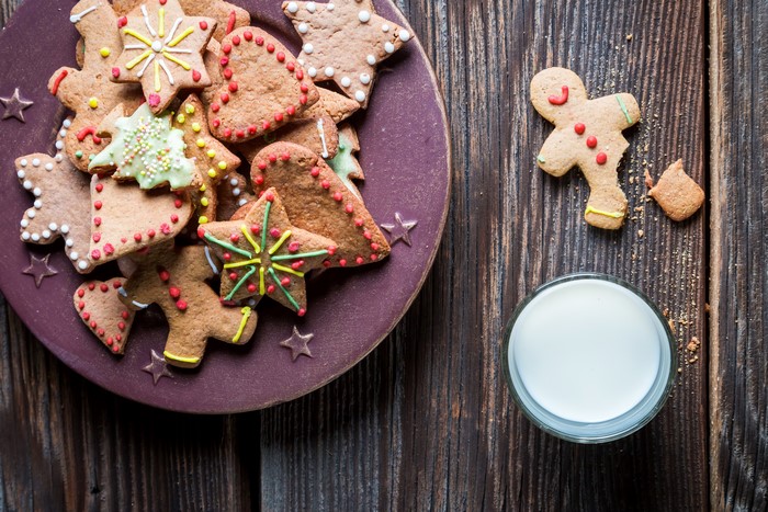 Christmas cookies and milk on wooden planks