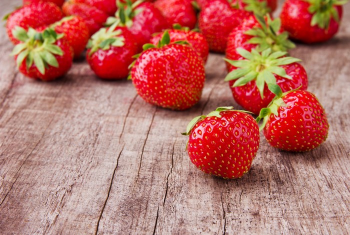Strawberries on a wooden surface