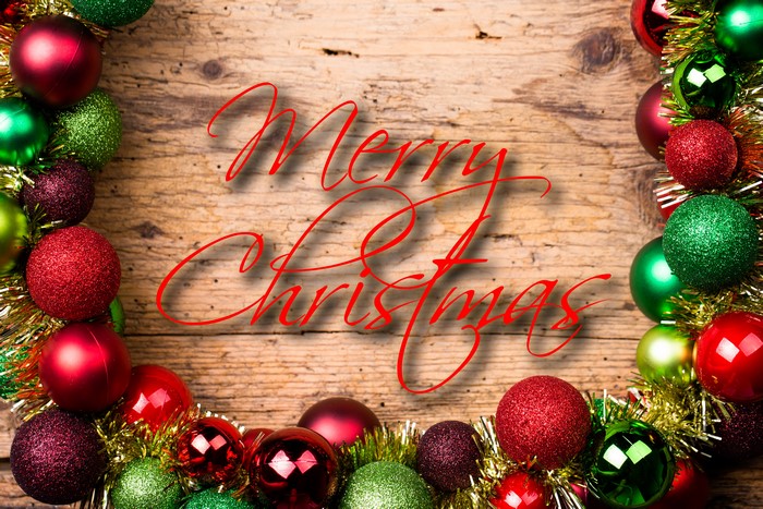 Merry Christmas ornaments on wood