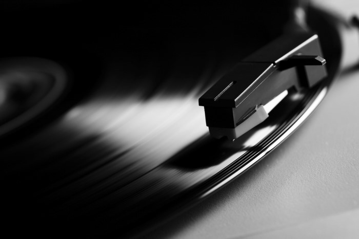 Close-up of a turntable stylus on a vinyl record