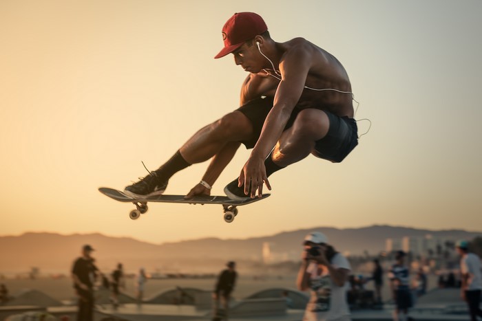 Man performing a jump trick on a skateboard