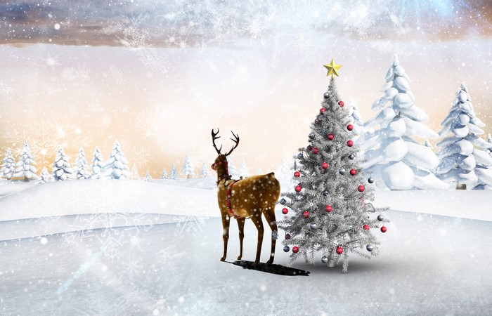Christmas scene with reindeer and decorated tree