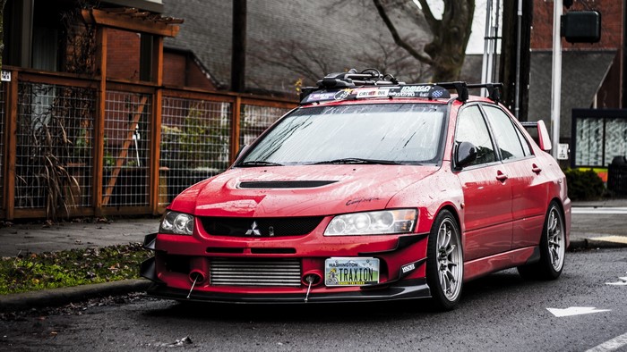 Red Mitsubishi Lancer Evolution 9 with Roof Rack