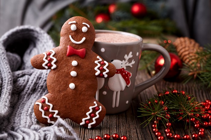 Gingerbread man with hot chocolate and Christmas decorations