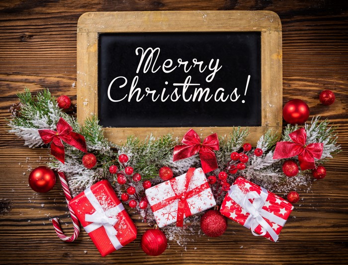 Merry Christmas chalkboard with gifts and ornaments