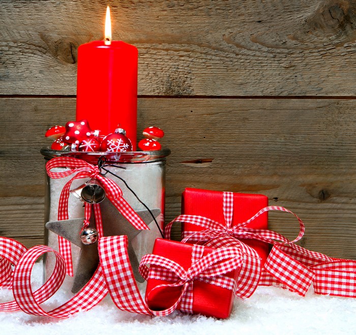 Christmas candle with gifts and ornaments