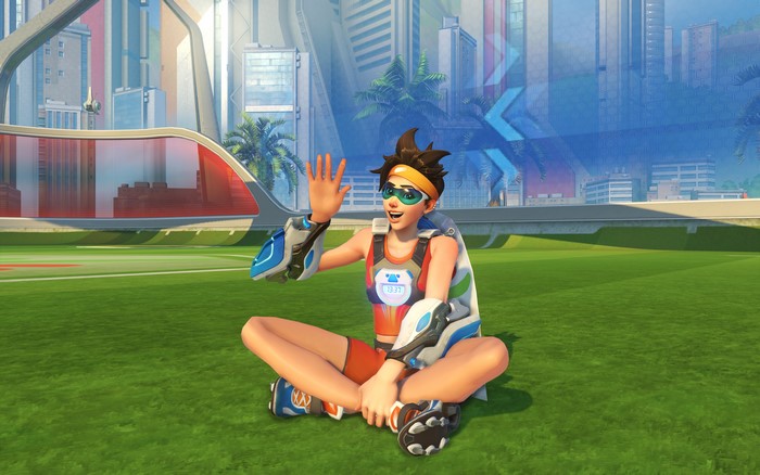 Tracer from Overwatch sitting on grass