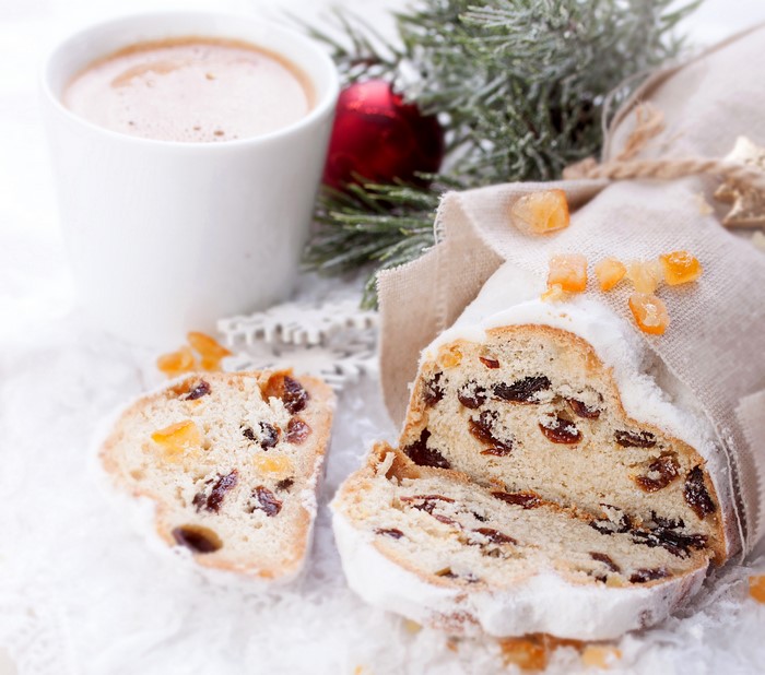 Christmas stollen with coffee and festive decorations