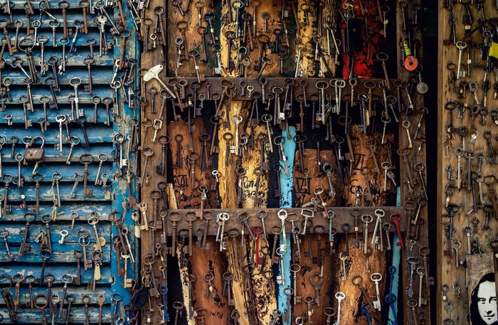 Collection of antique keys on wooden boards