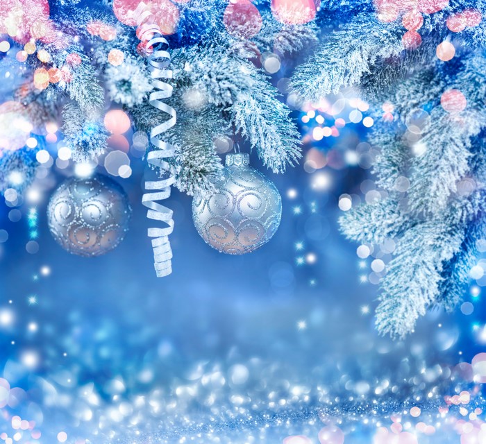 Christmas tree branches with ornaments and snow