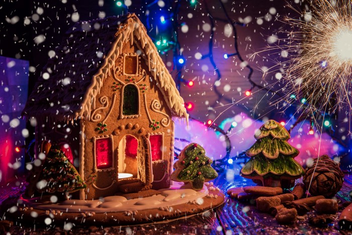Gingerbread house with sparkler and Christmas lights
