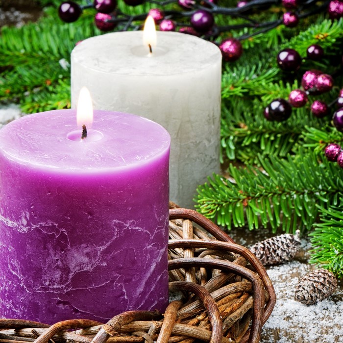 Christmas candles with pine branches and berries