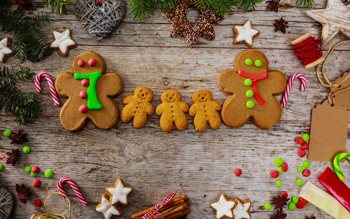 Christmas gingerbread cookies and decorations on wooden table