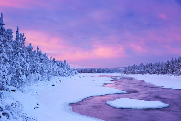 Winter river in Lapland, Finland at sunset