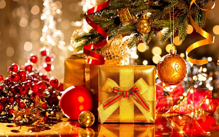 Christmas tree with gold ornaments and gifts