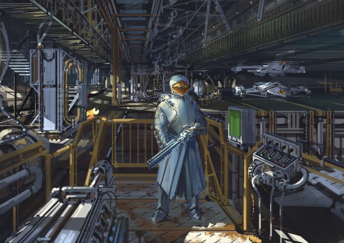 Warrior in futuristic armor with a rifle in a factory