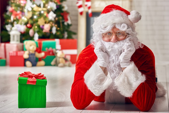 Santa Claus with Christmas Tree and Gifts