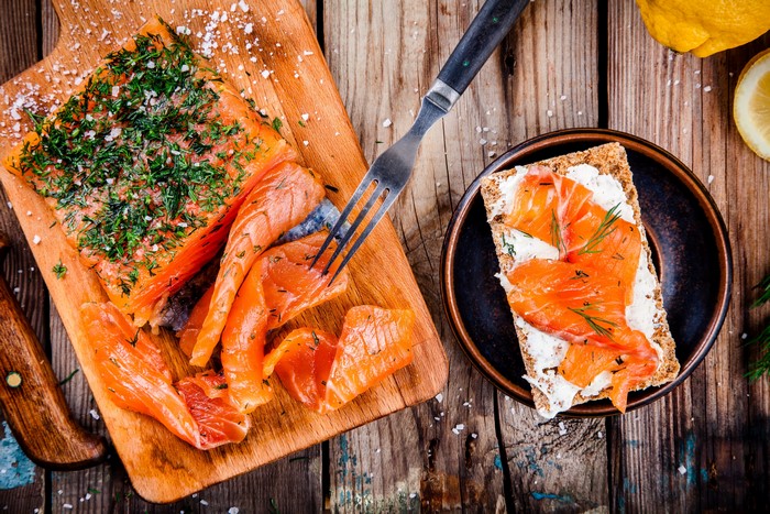Smoked Salmon with Dill and Salt on a Cutting Board
