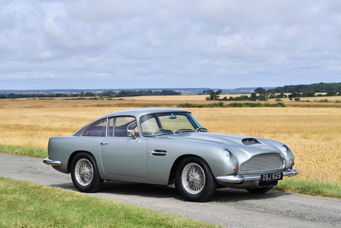 Grey Aston Martin DB4 GT Touring on a road