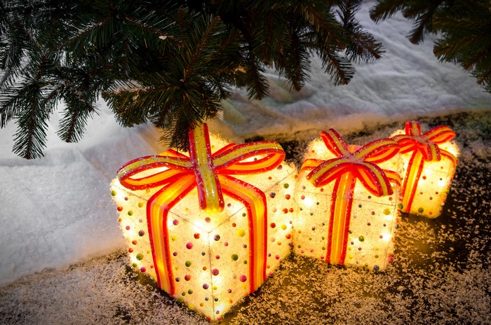 Illuminated Christmas Gifts Under a Tree