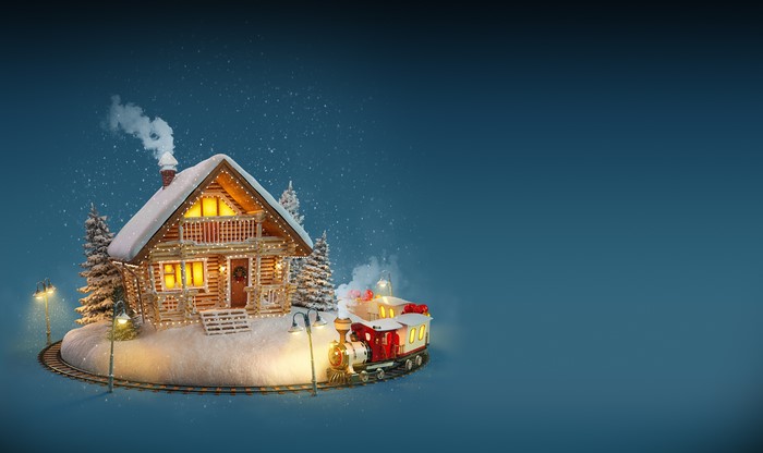 Christmas cabin with train and snow