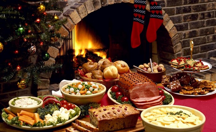 Christmas Feast with Ham, Pastries, and Vegetables by Fireplace