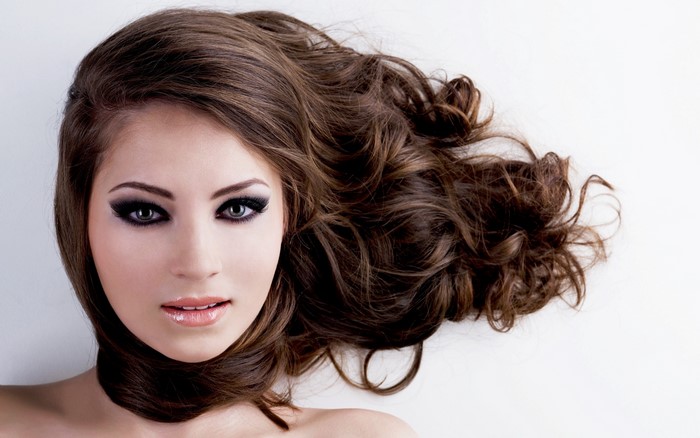 Brown haired woman with dramatic makeup