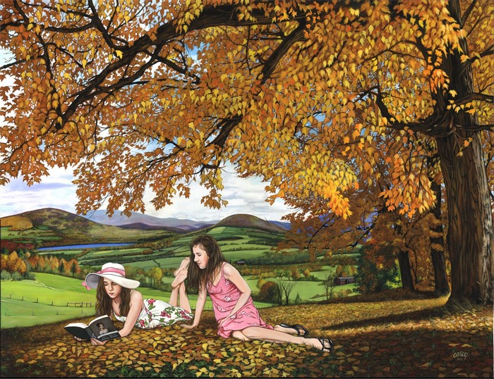 Two girls reading under a tree in autumn