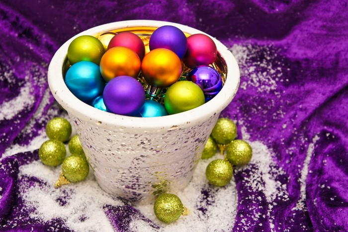 Christmas ornaments in a vase with snow