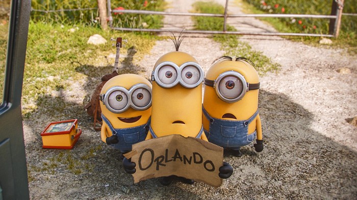 Three Minions holding an Orlando sign