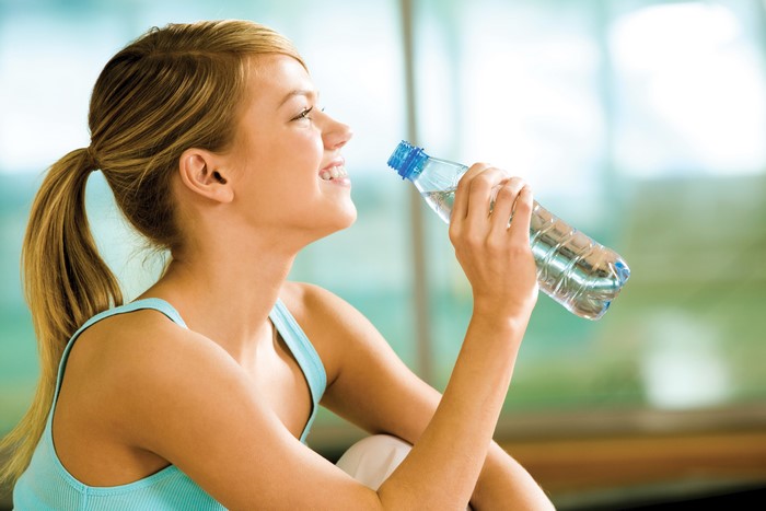 Woman drinking water from a bottle