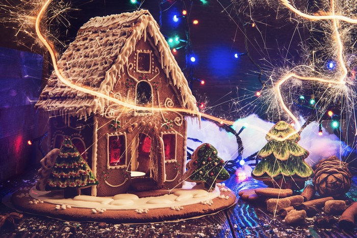 Gingerbread house with Christmas lights and sparklers