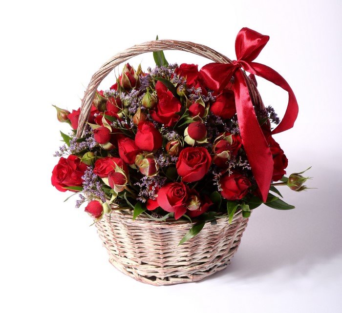 Basket of red roses with a red bow