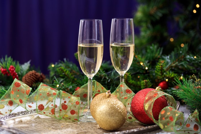 Two glasses of champagne with Christmas decorations