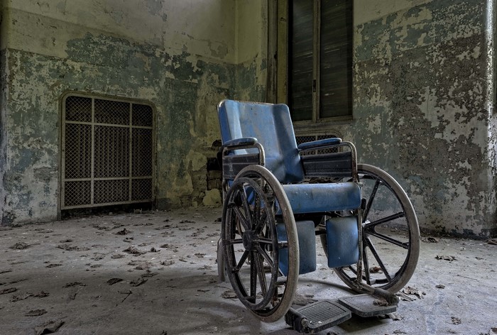 Wheelchair in abandoned room