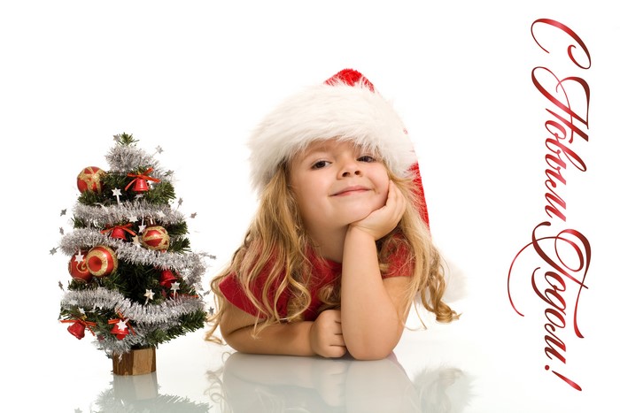 Girl in Santa hat with Christmas tree