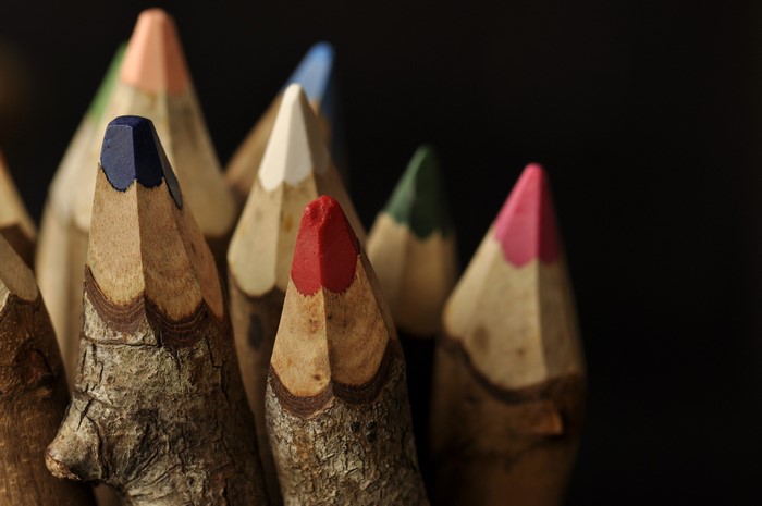 Close-up of colorful pencils on a black background