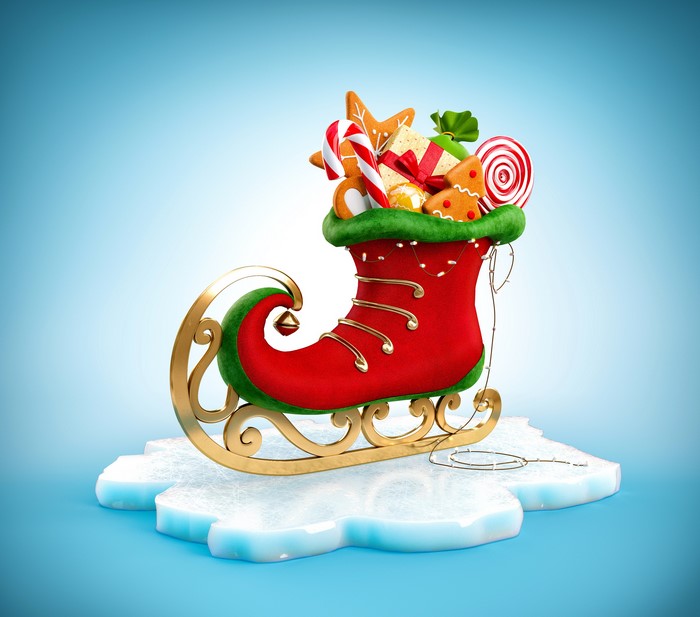 Christmas elf boot sleigh filled with sweets on ice