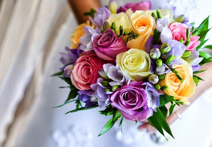 Colorful wedding bouquet of roses and freesia