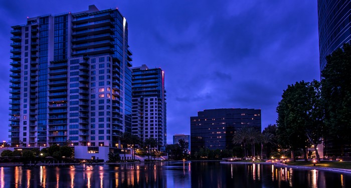 Apartment Buildings Reflected in Water at Night