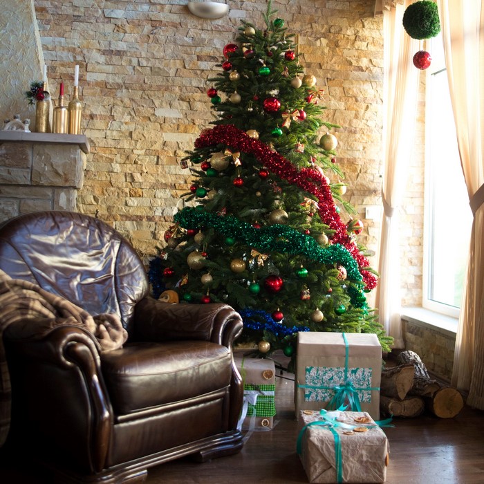 Christmas tree with gifts and armchair