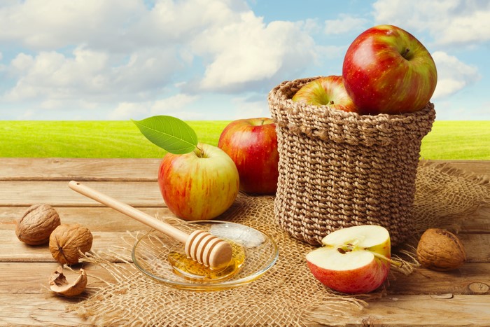 Apples and Honey on a Wooden Table